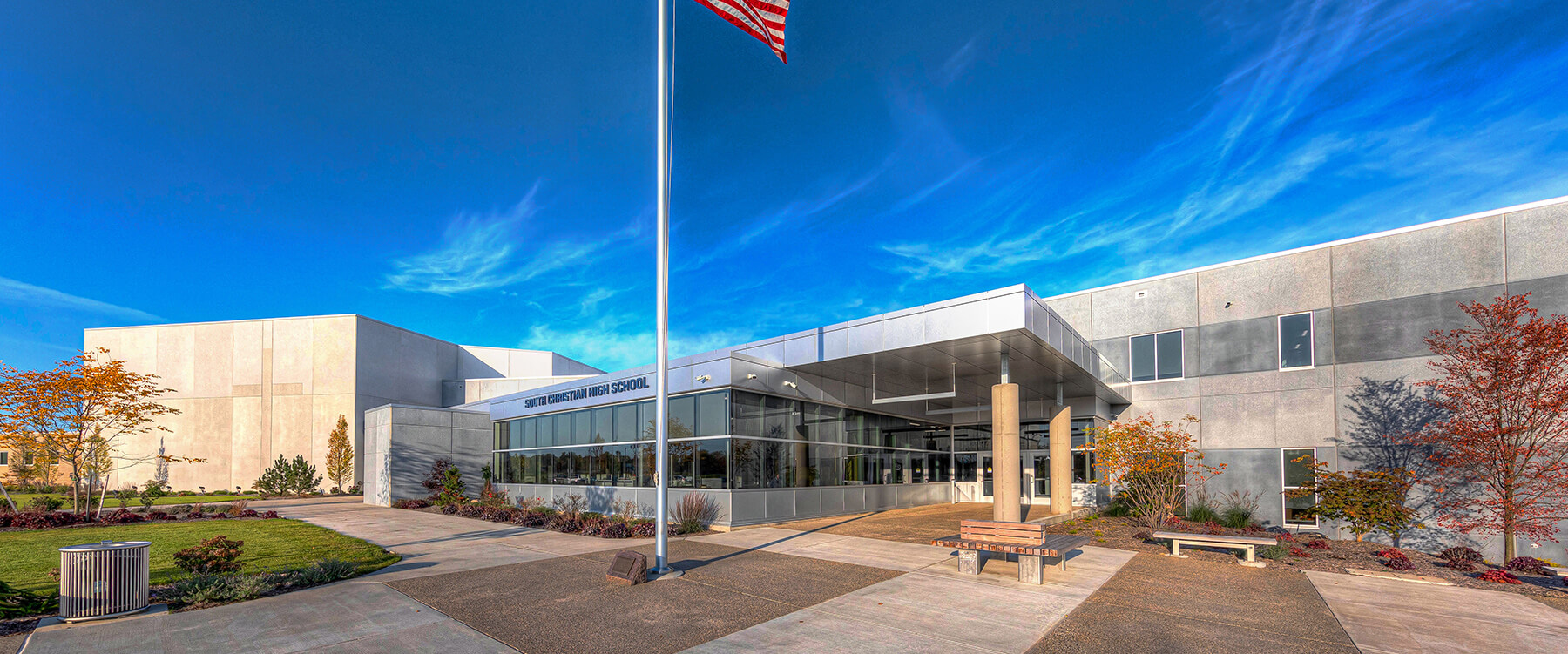 exterior entrance to South Christian High School with a flagpole