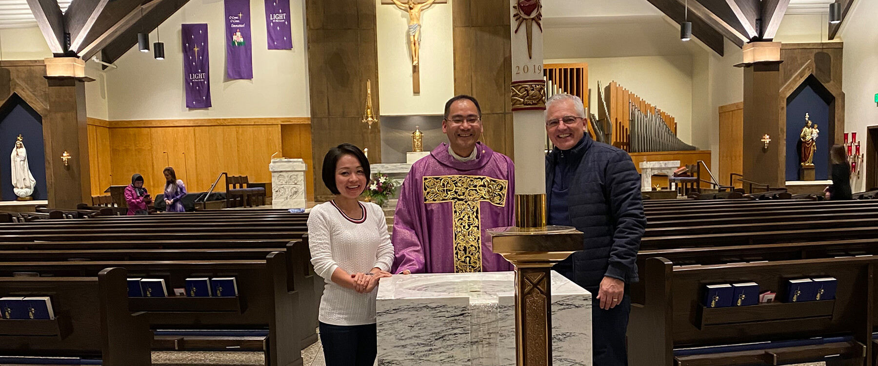 Peter Baldwin with staff at the dedication of St. John Paul II Catholic Church