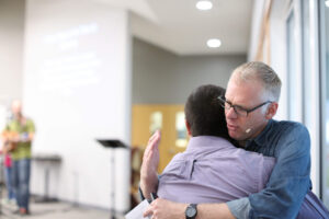 Two men embracing