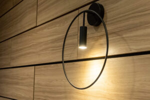 Modern sconce on a wood slat wall