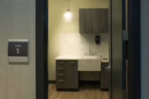 View of the sink and cabinets in an exam room