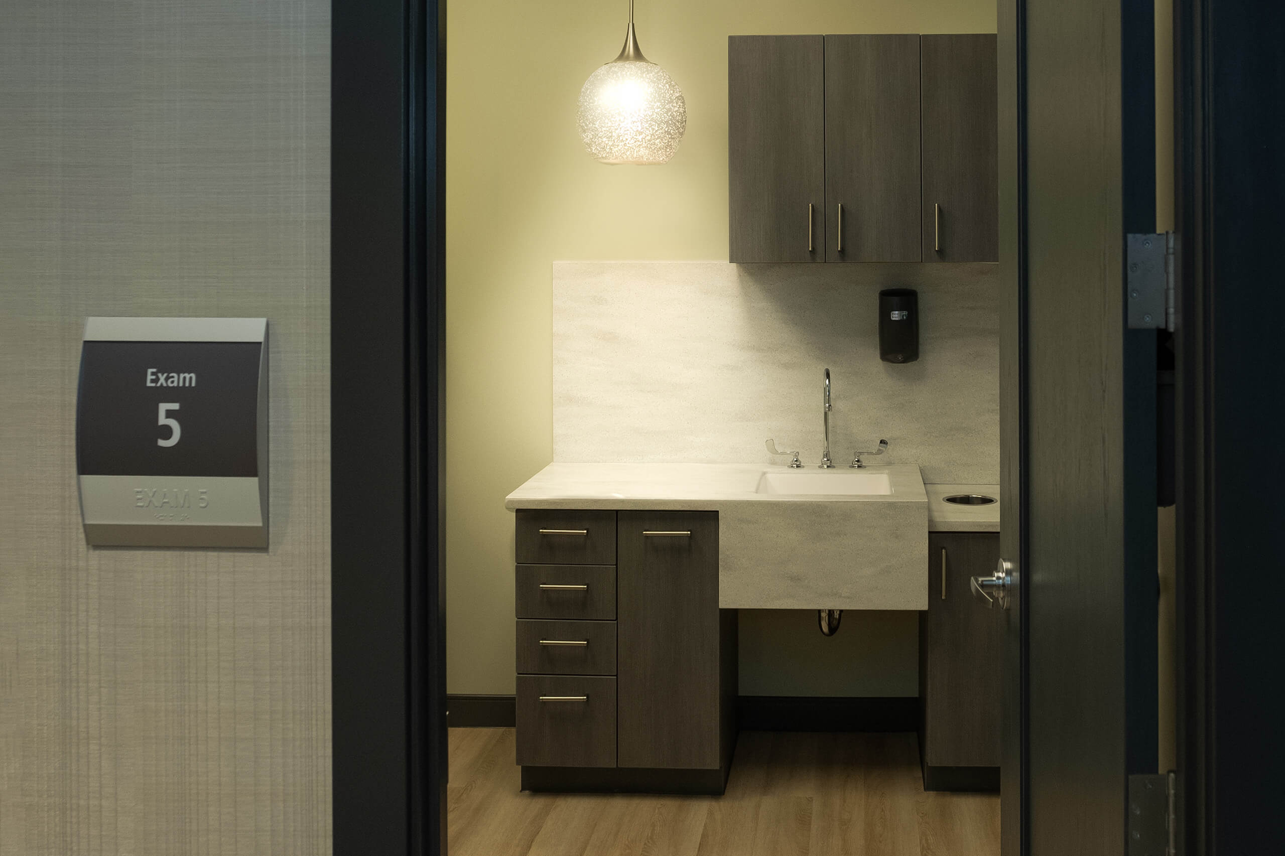 View of the sink and cabinets in an exam room