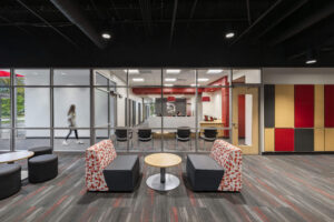 View from a lounge area looking into the reception area through a wall of windows