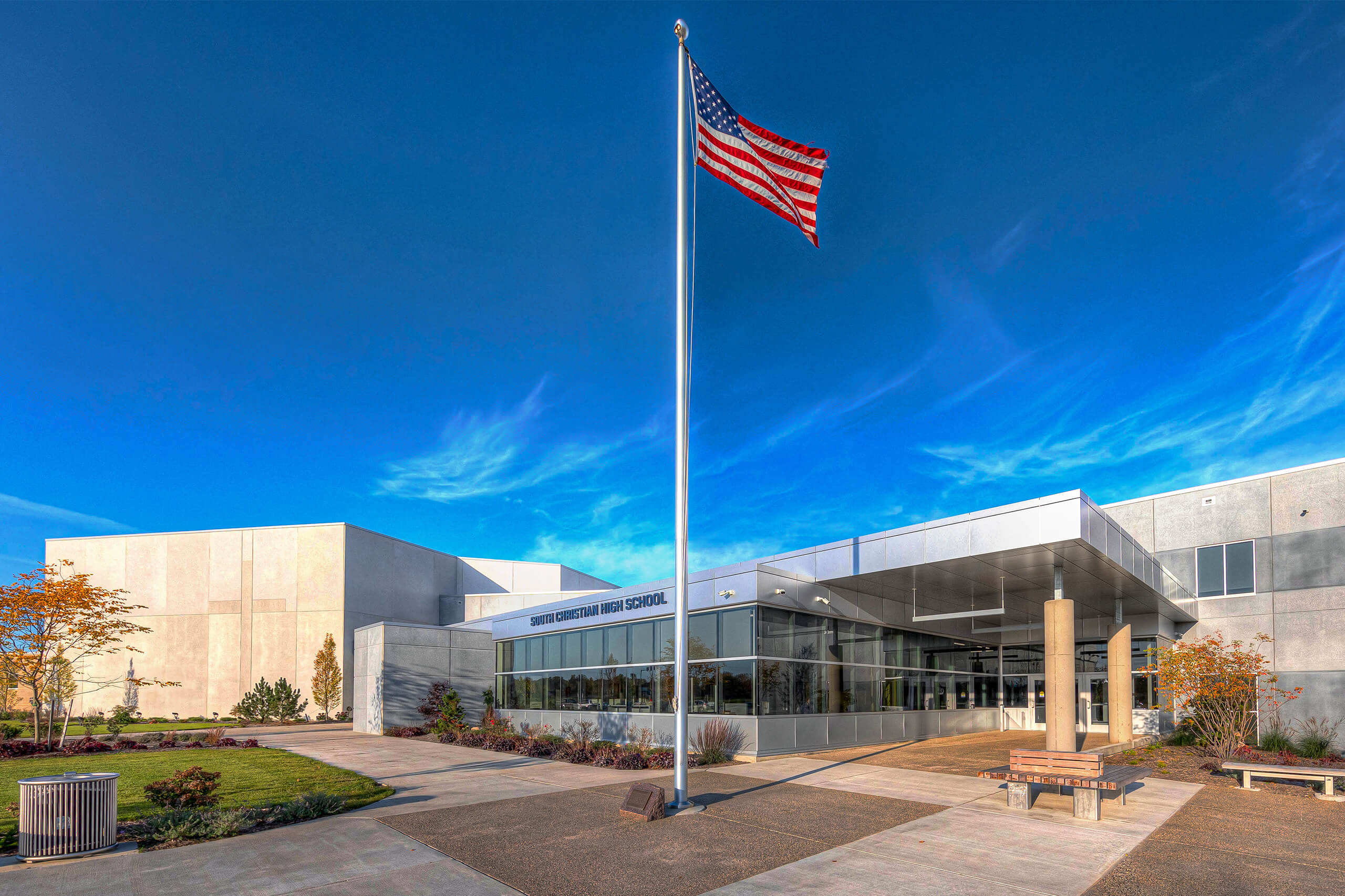 Exterior view of South Christian High School featuring the flag pole