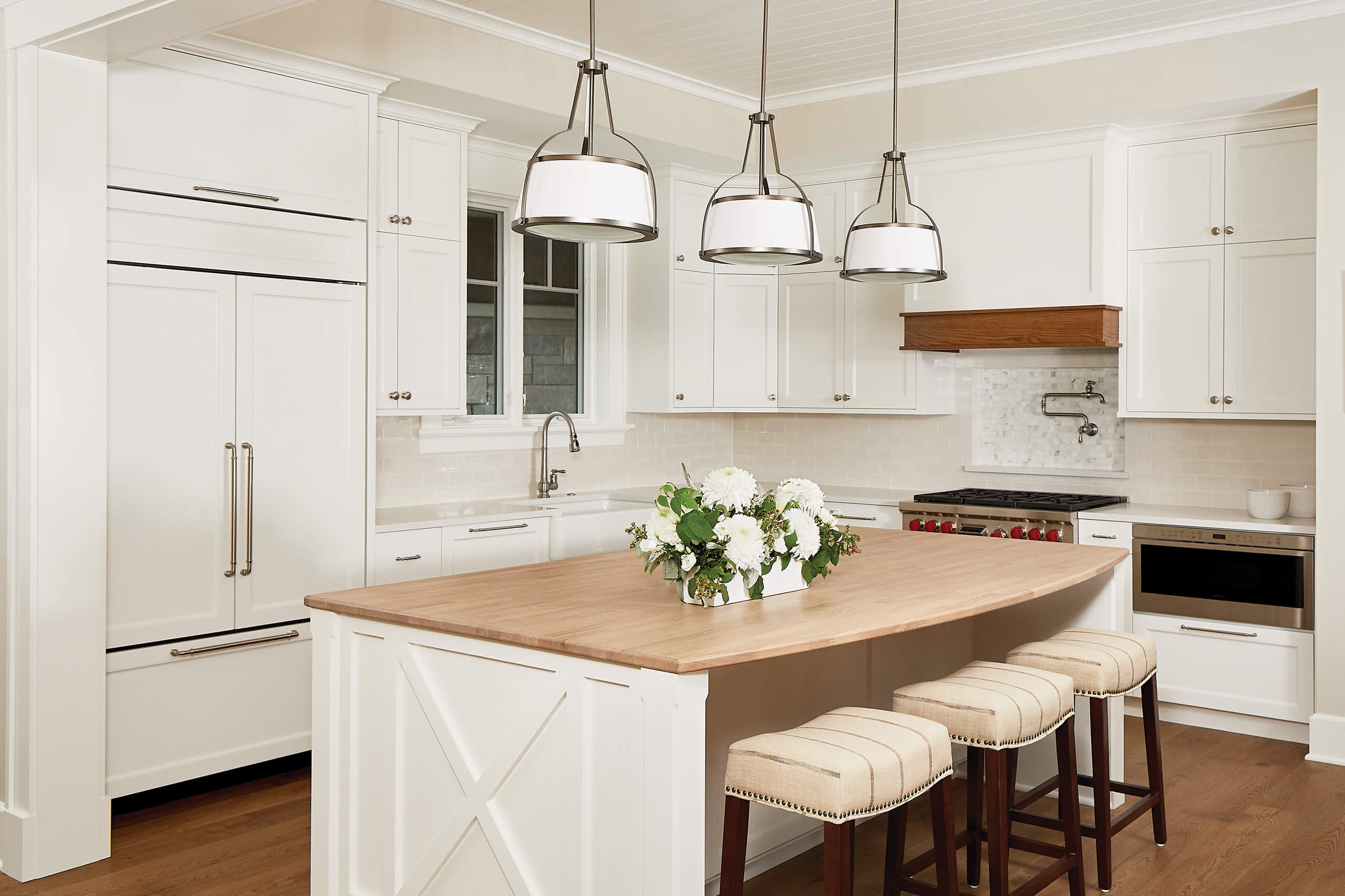 residential family home interior of a kitchen with white cabinet and walls