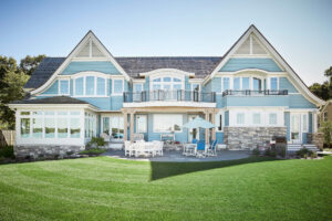 exterior facade of a blue lakefront cottage