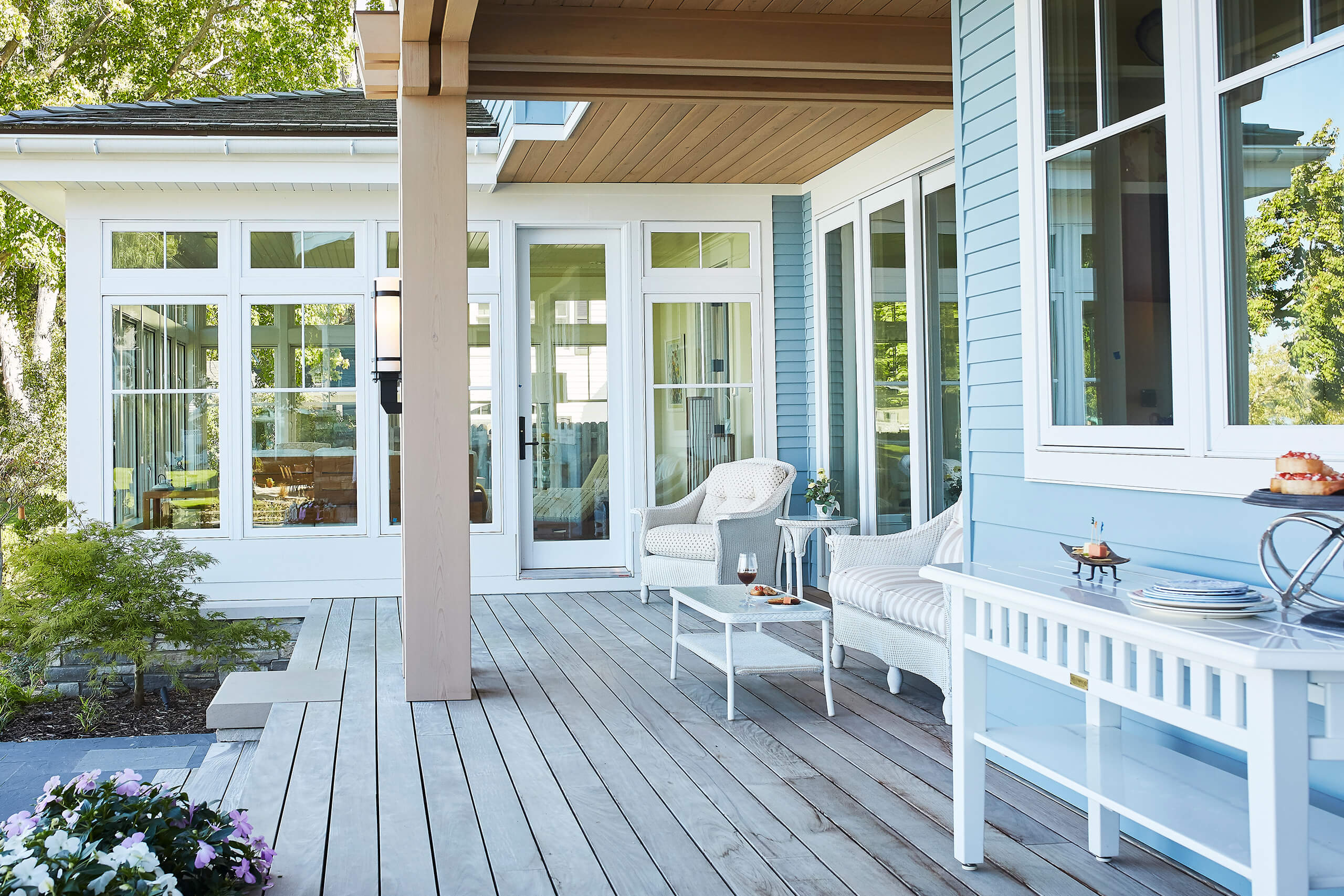 residential lakefront cottage outdoor view of deck seating under the porch