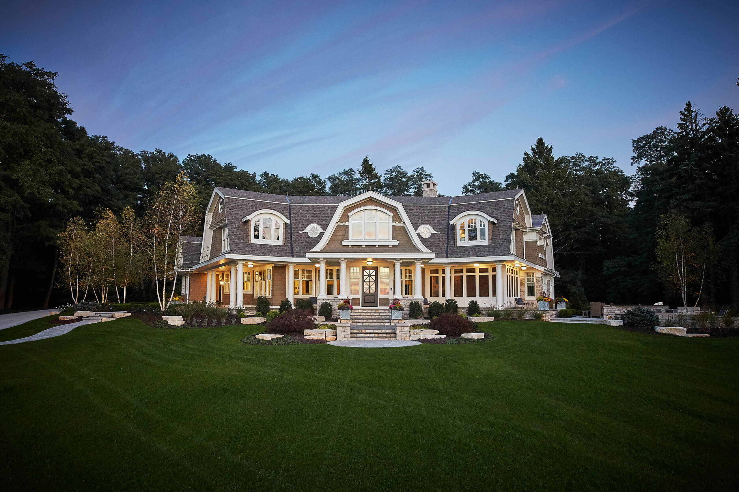 exterior view of a residential home featuring stone steps to the front door