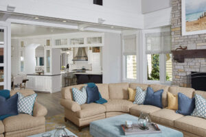 interior of a residential home featuring white walls and trim and brown seating area