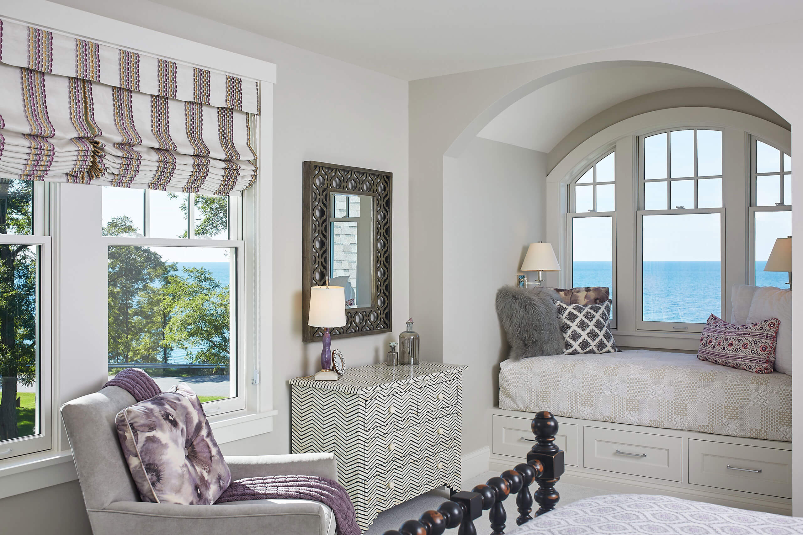 interior view of a residential home bedroom looking out the window to the lake