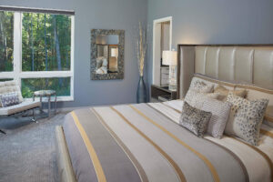 residential modern home bedroom view with a gray bed and decor