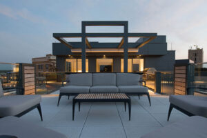 top of the building deck with exterior furniture outside an urban loft