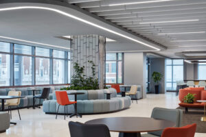 interior view of a modern office space with multicolored soft seating, tables and chairs