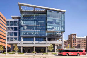 exterior city view showcasing a modern glass office building downtown Grand Rapids