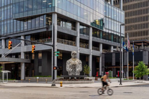 exterior city view showcasing a modern glass office building downtown Grand Rapids at street view