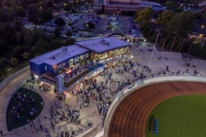 Grand Rapids Christian School admin building aerial drone shot at night with people walking around