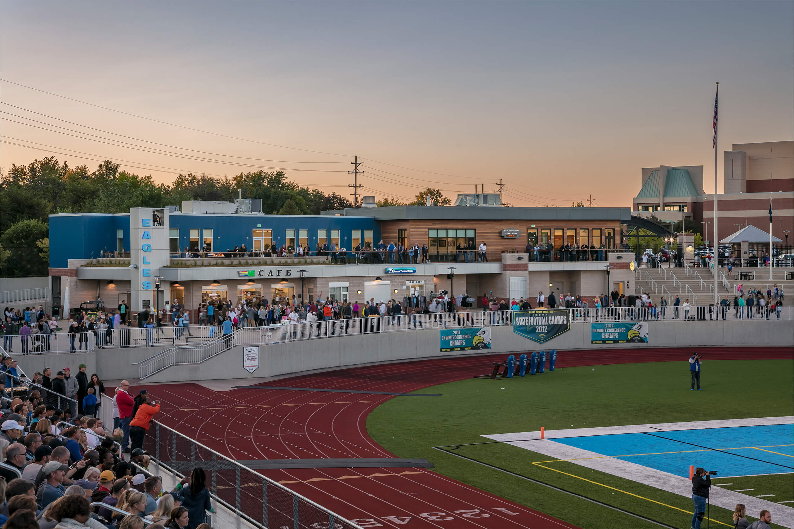 exterior view of the Grand Rapids Christian School admin building during a sporting event at the adjacent field