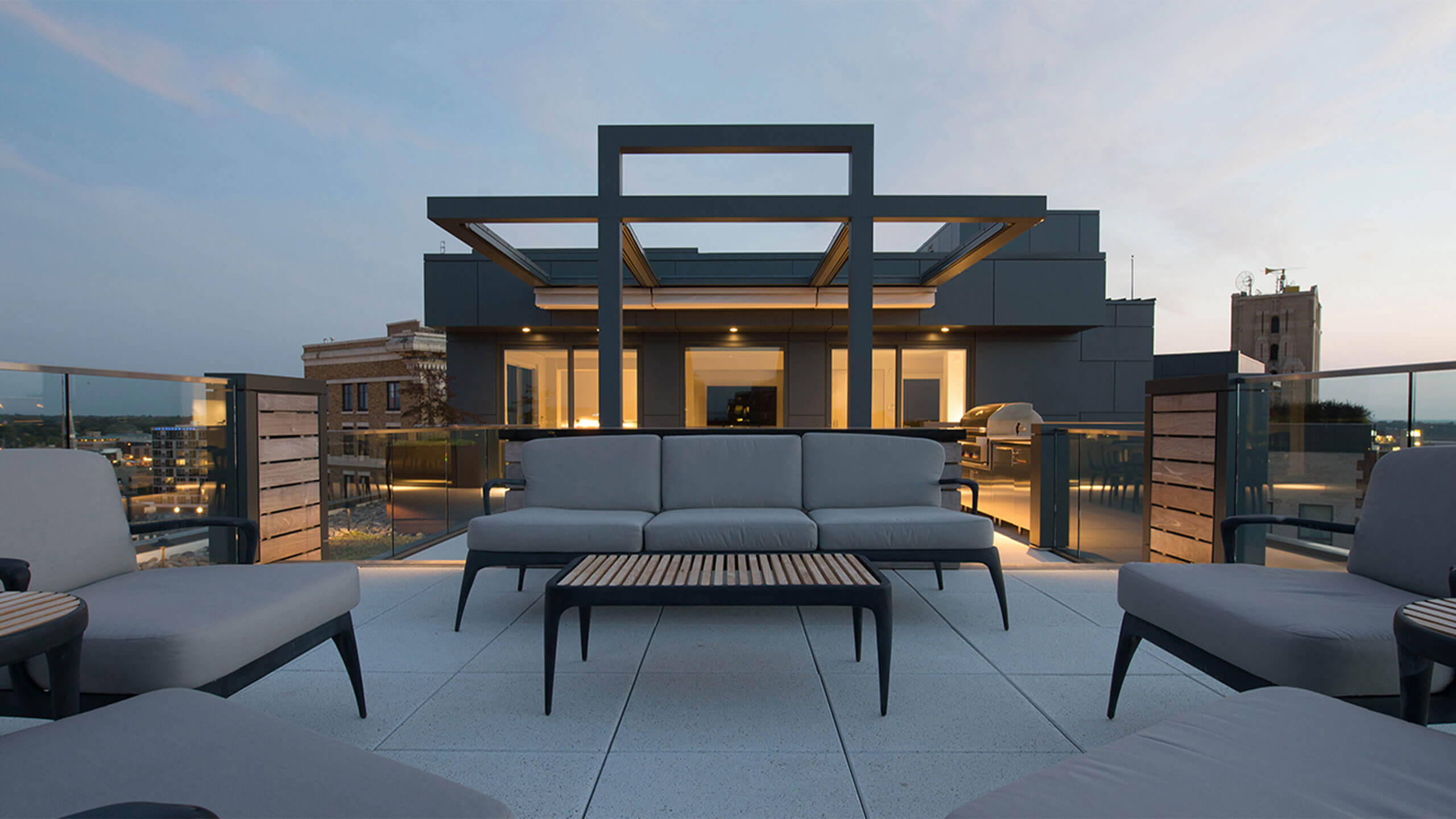 top of the building deck with exterior furniture outside an urban loft