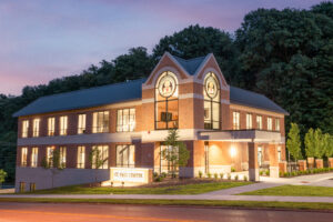 St. Paul Center for Biblical Theology at night, brick building lit from inside.