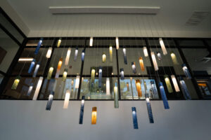 St. Paul Center for Biblical Theology interior photo of hanging glass lights of various lengths and colors.