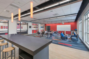 Interior lounge of Timothy Christian Middle School soft seating and table area.