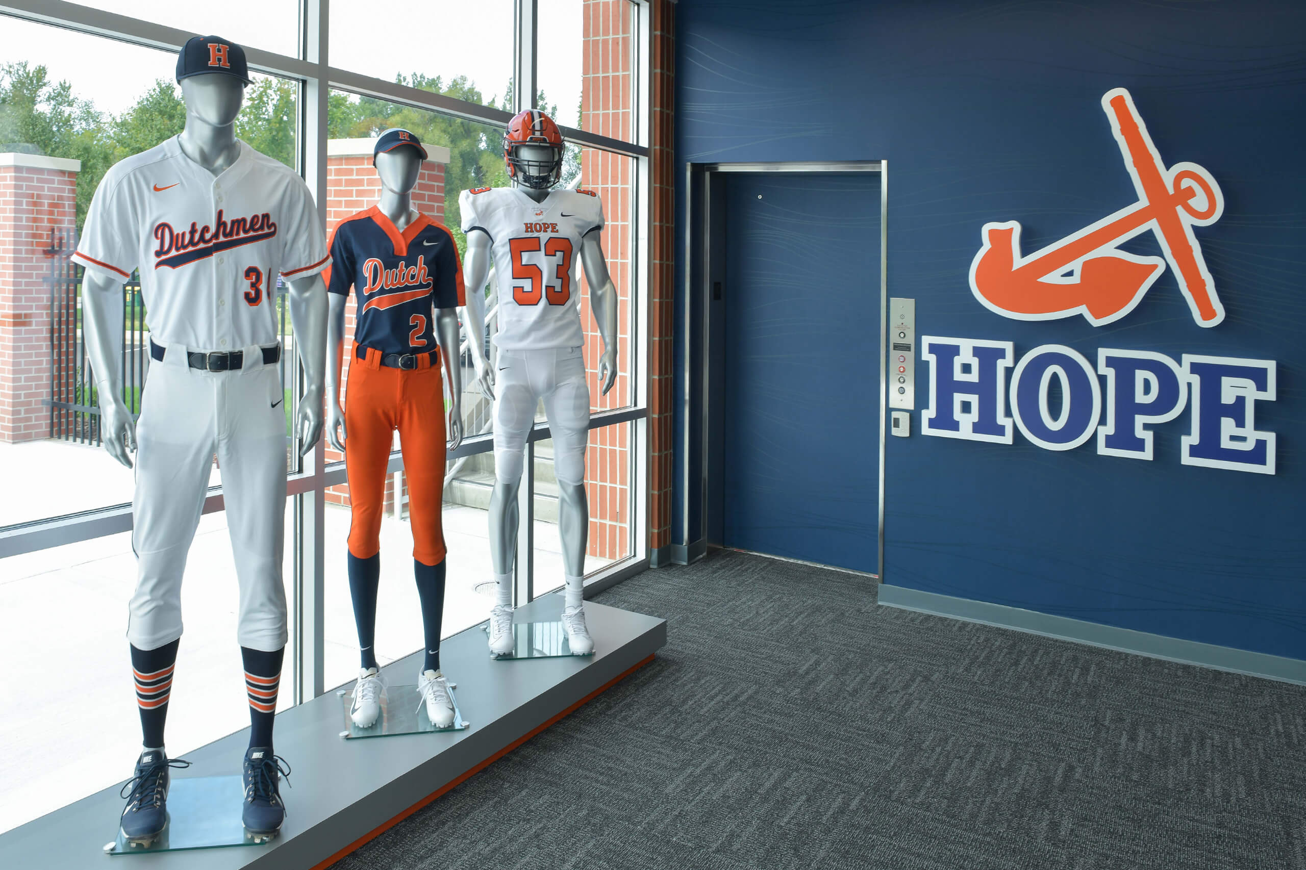 Mannequins wearing Hope College athletic uniforms