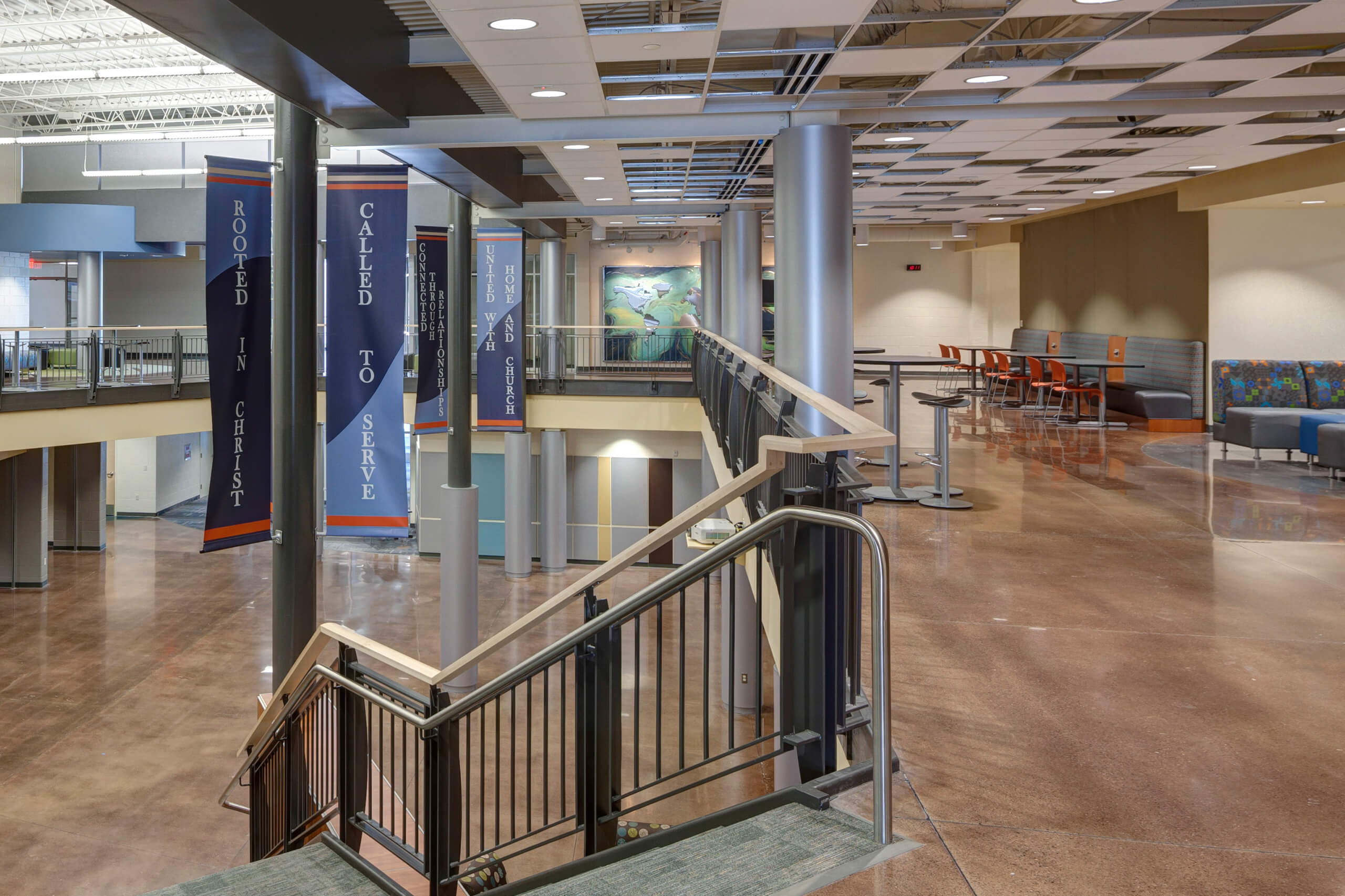 upper level school hallway with open common spaces for learning