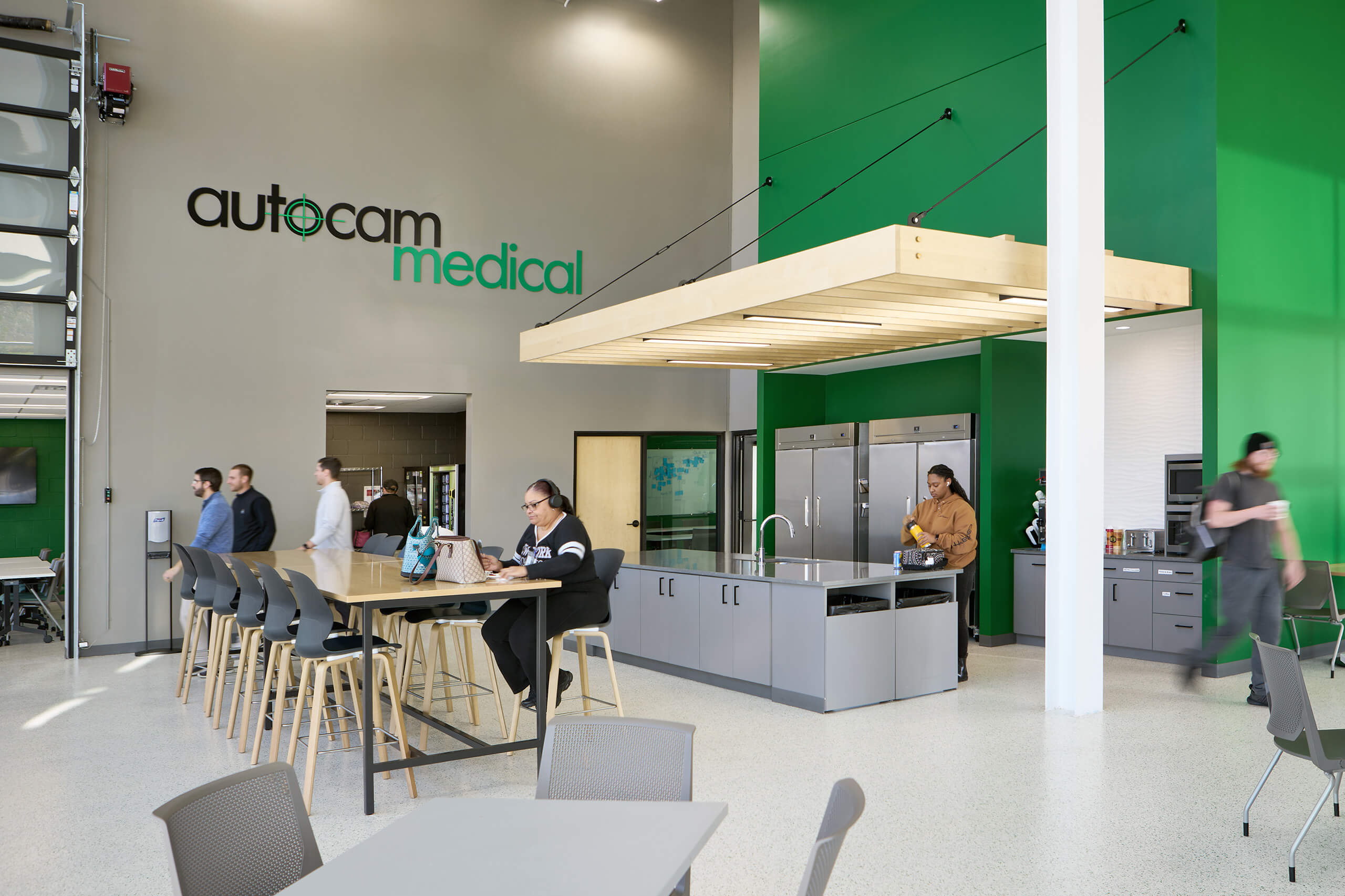 Autocam Medical interior view of kitchen / break room with people