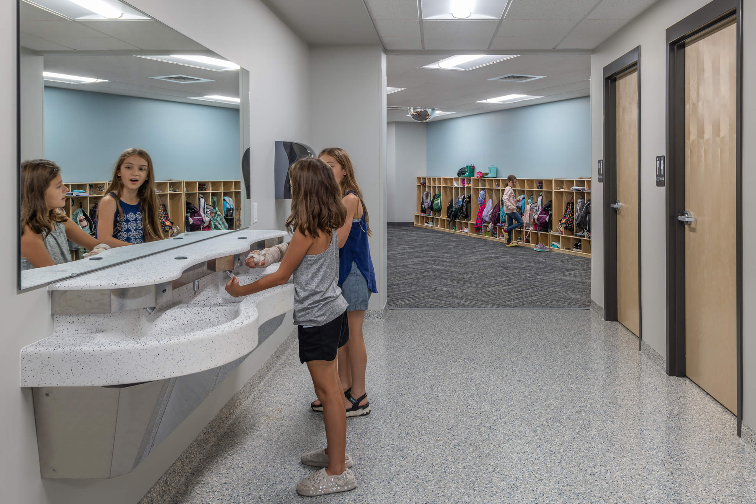 Two female students in the bathroom at Bethany Christian Schools.