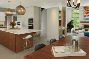 view of modern style kitchen and dining room with view into living room