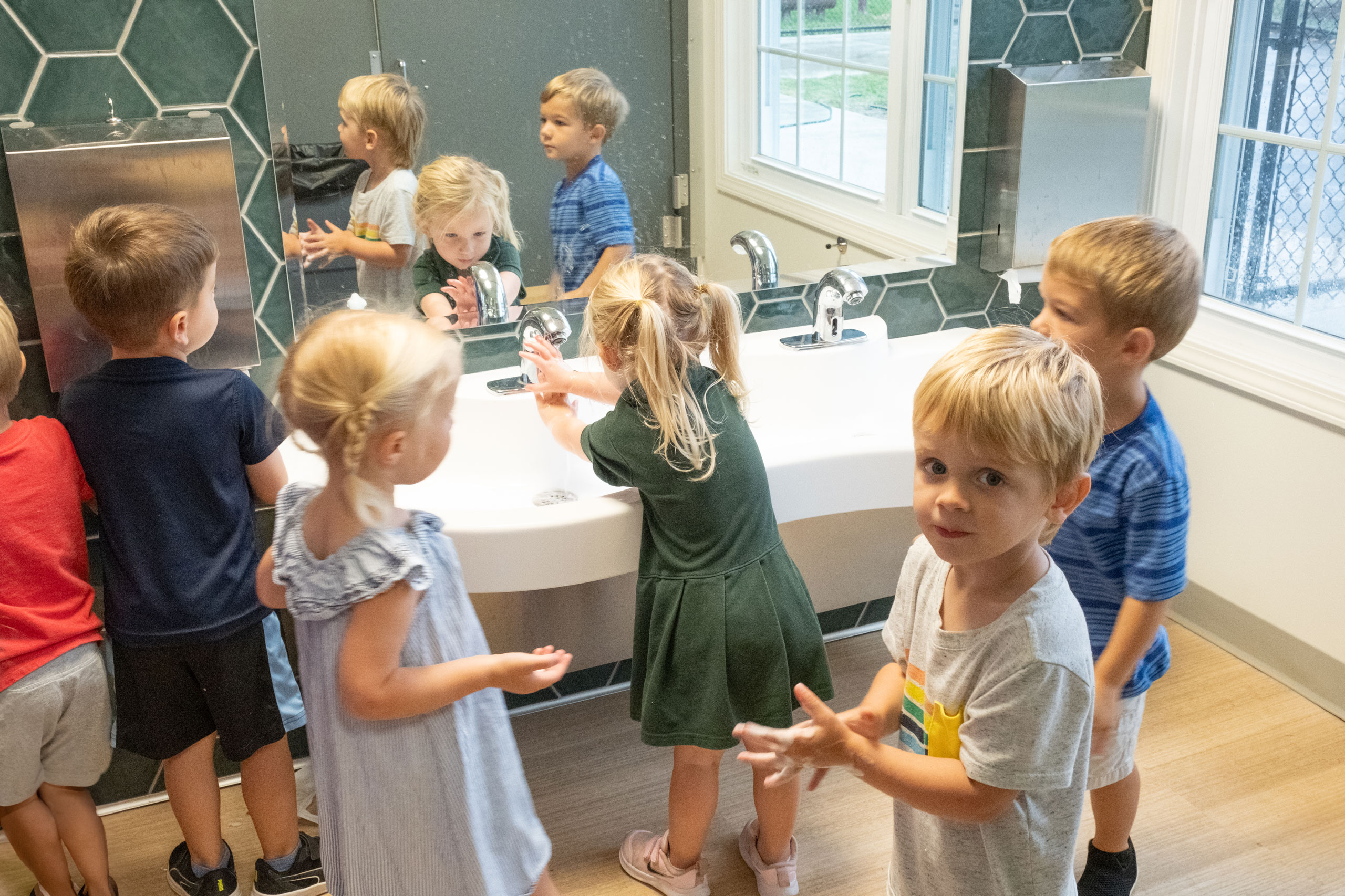 St. Paul the Apostle - Early Childhood Center children washing hands in bathroom