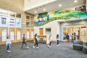 line of students walking through front lobby entry at Ada Christian School