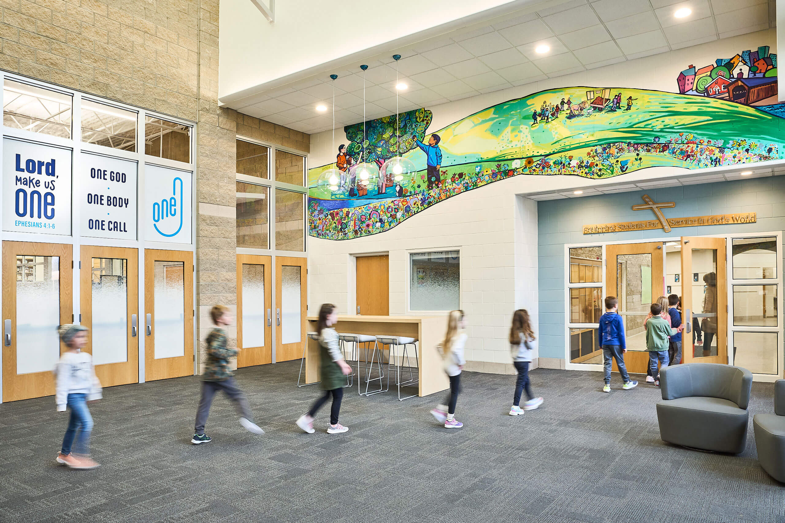 line of students walking through front lobby entry at Ada Christian School