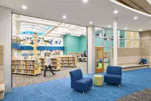 Ada Christian School library viewed from adjacent flexible commons space