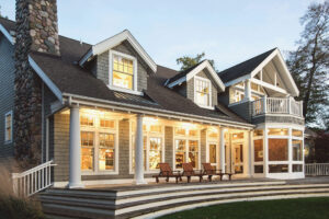 cottage exterior porch lit up at dusk