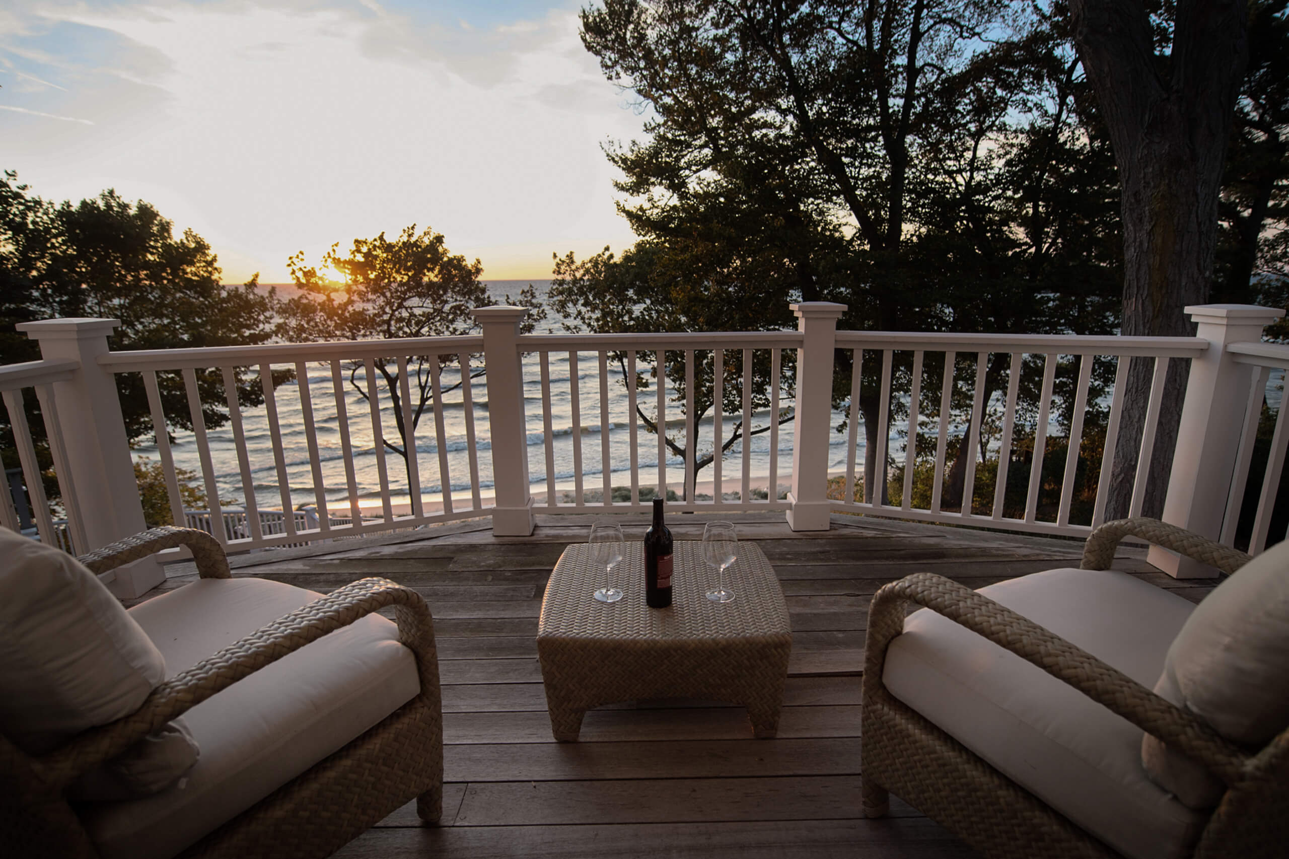 sunset view from porch overlooking a lake