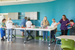 group of people of various abilities cooking together