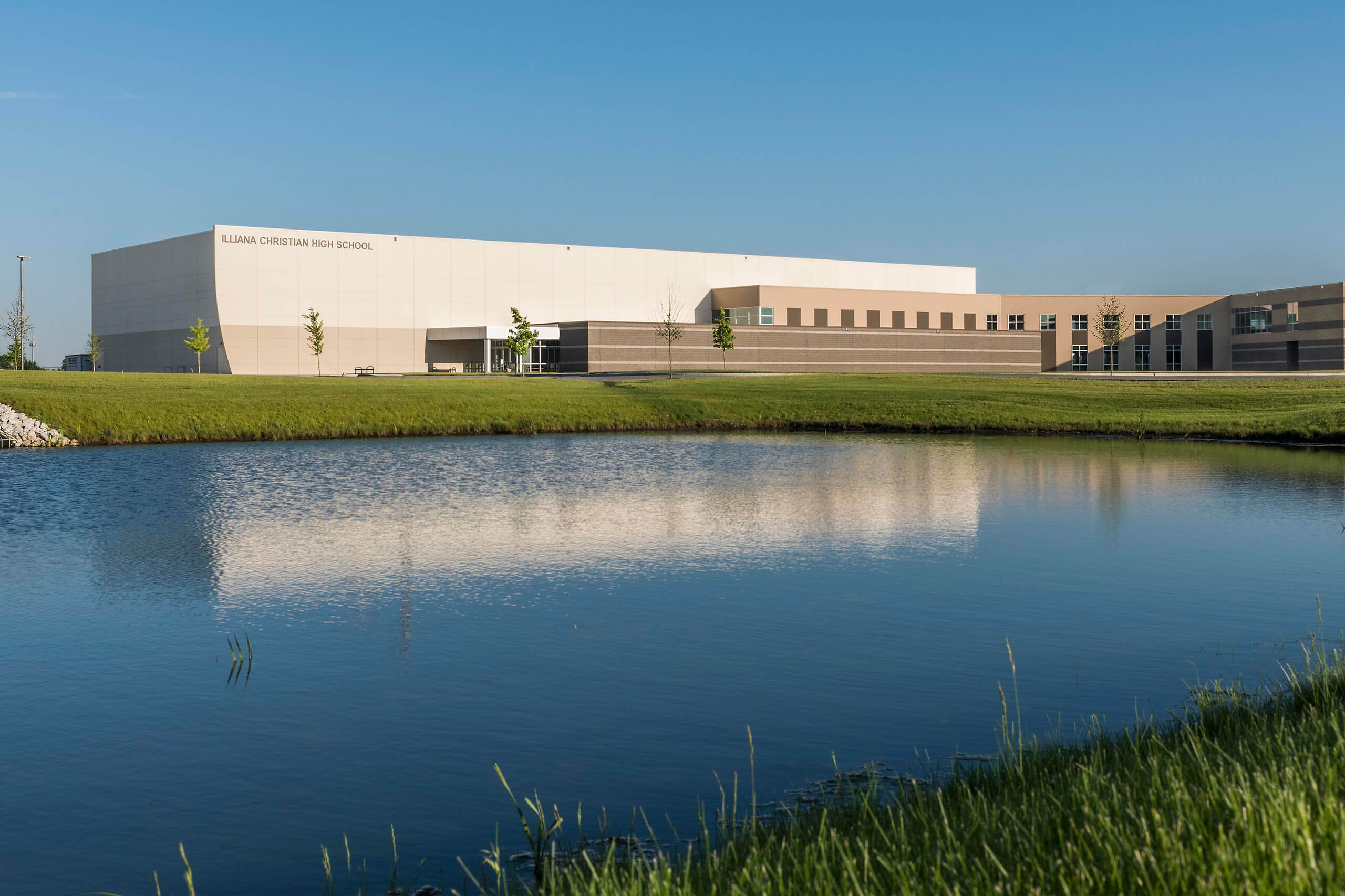exterior of Illiana Christian High School overlooking a pond
