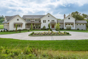 exterior front view of home with landscaped circle drive